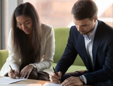Couple Signing Prenuptial Agreement
